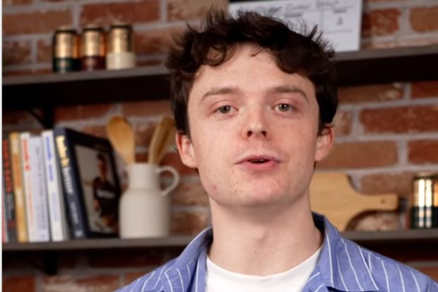 A young man speaking.