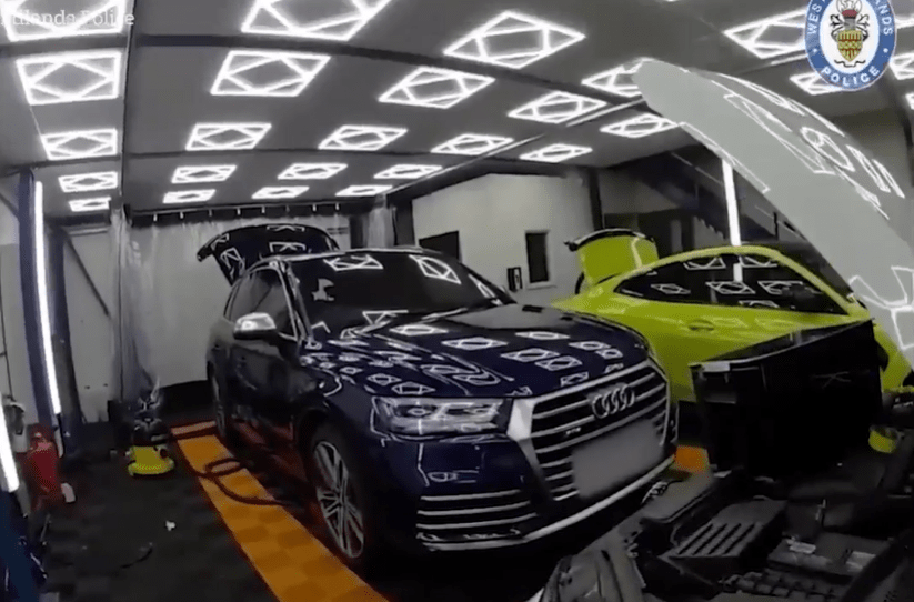 Police recovered stolen luxury cars in a workshop.