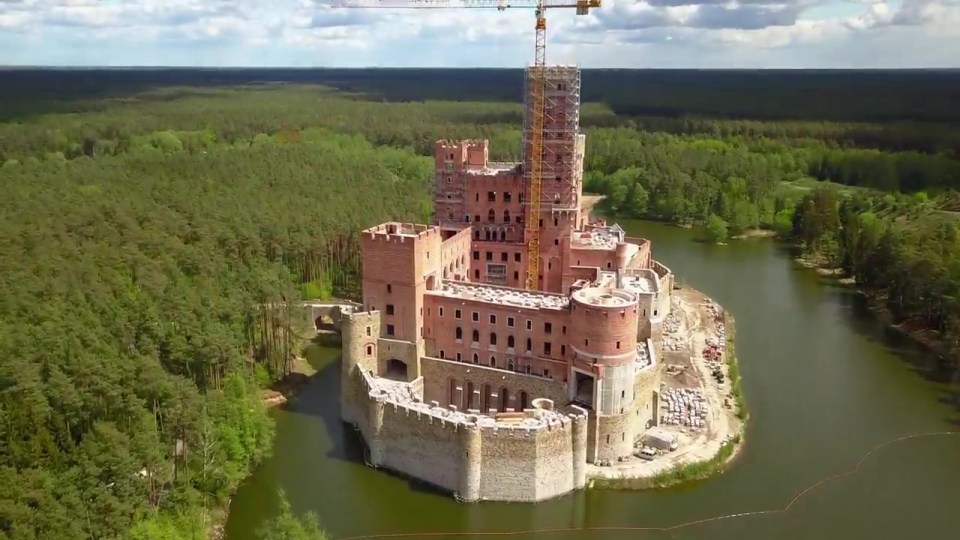 The bizarre castle was built on a man-made island on the lake