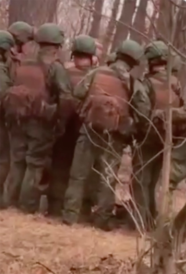 North Korean troops training in a wooded area.