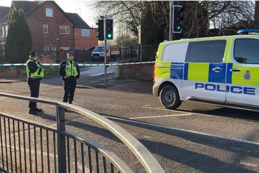 Officers guard a police cordon in Ilkeston