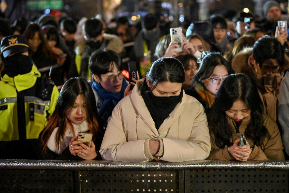 South Koreans paid tribute to the victims of the Jeju Air plane crash at their subdued New Year's Eve celebrations