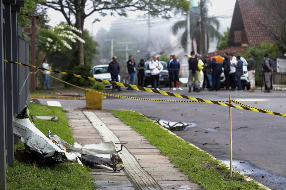 A piece of the plane that crashed in the centre of Gramado lies on the ground