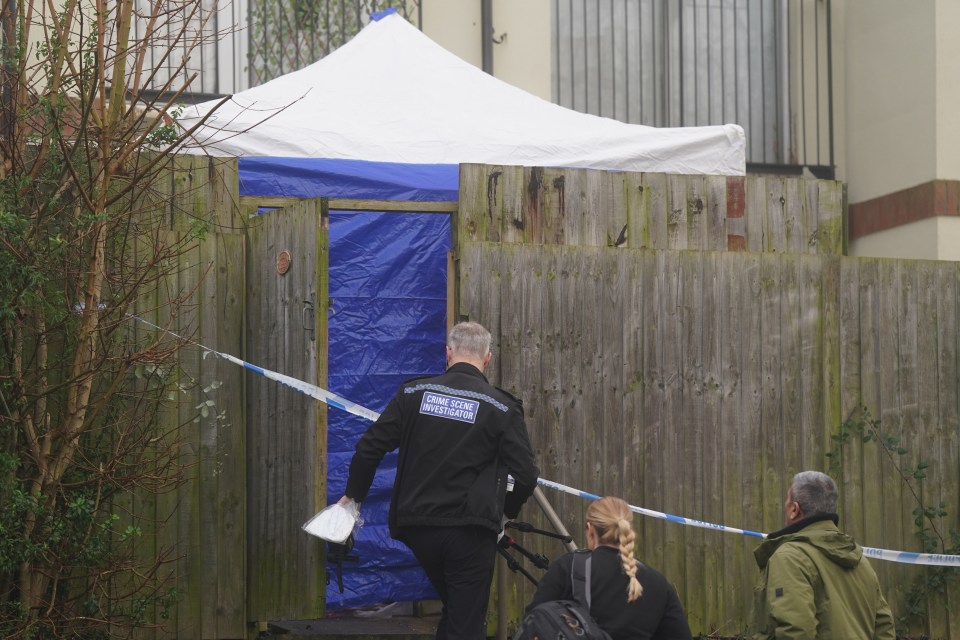 Crime scene investigators at a residential scene.