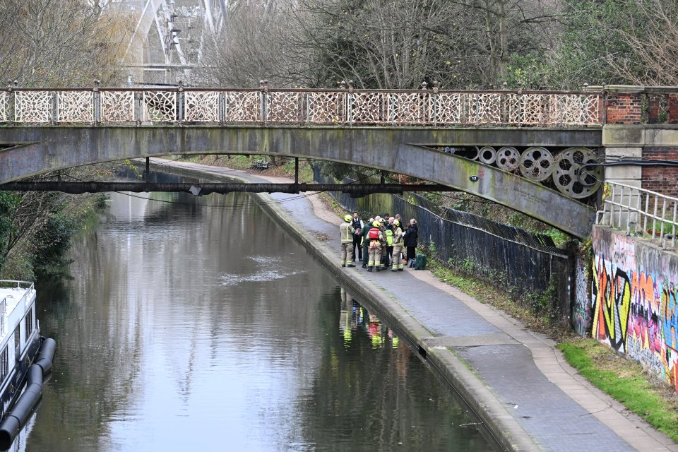 Police and emergency services recover a man's body from the Regent's Canal near to London Zoo today