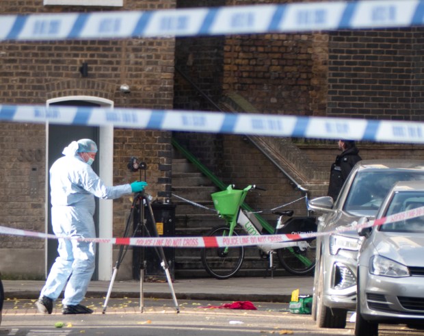 Crime scene in Ladbroke Grove, London; police investigate a double shooting.