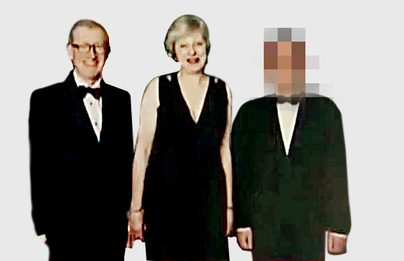 The man with Philip and Theresa May