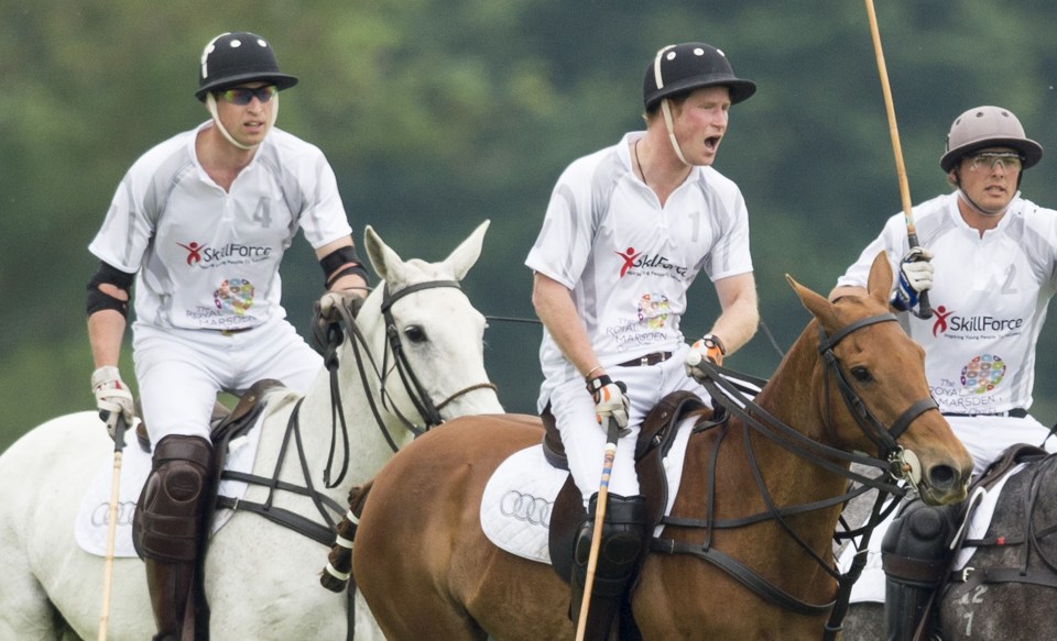 William and Harry competing in a polo match together