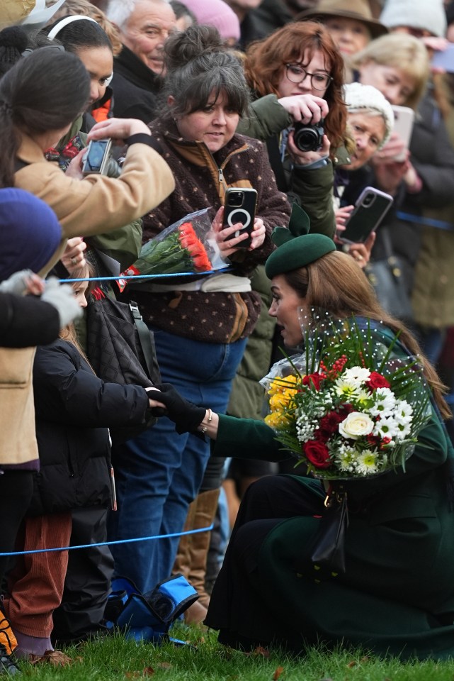 The Princess of Wales speaks with members of the public and accepts flowers after a Christmas Day church service.