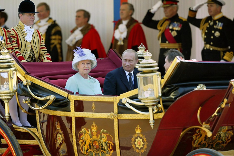 Queen Elizabeth II and Russian President Vladimir Putin arrive at Horse Guards Parade in 2003