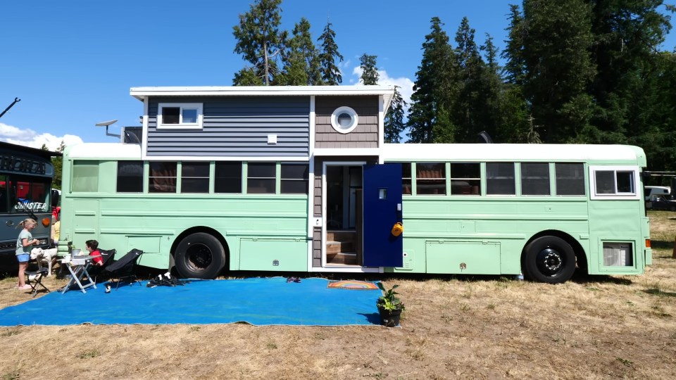 The couple added a second floor to their converted school bus, which they live in with their five children