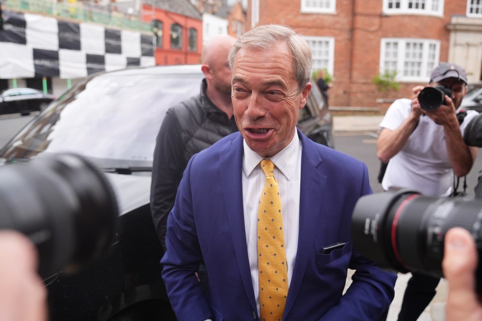 Nigel Farage speaking to reporters.