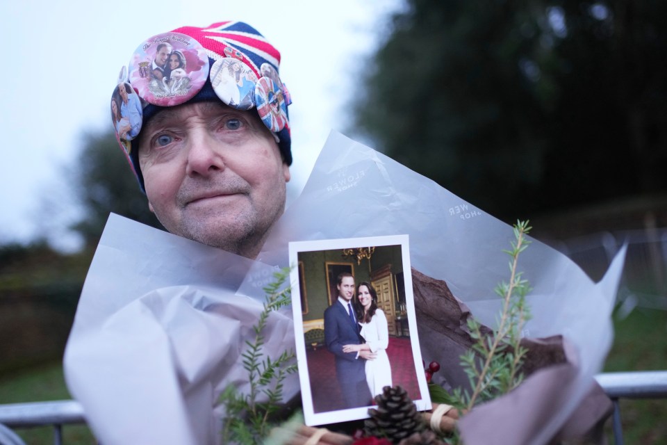 Royal fan John Loughrey holds a photo of Prince William and Kate