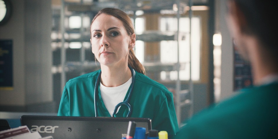 Stevie, a Casualty nurse, looks serious.