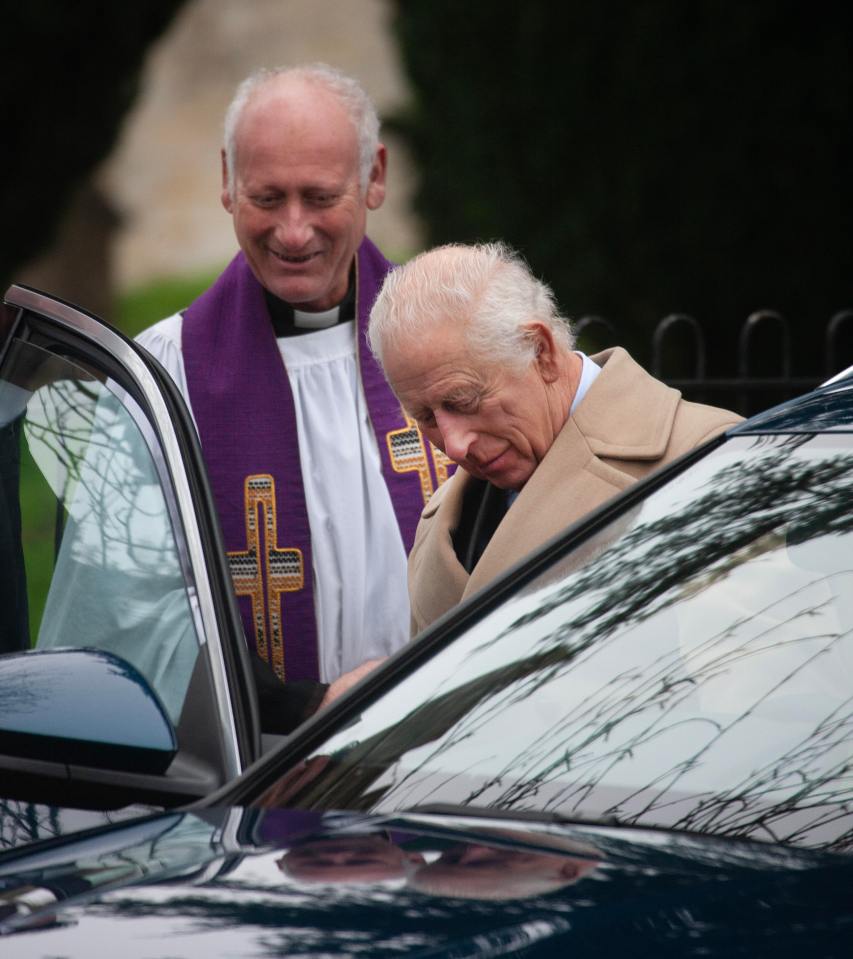 Charles gets into a car after the service