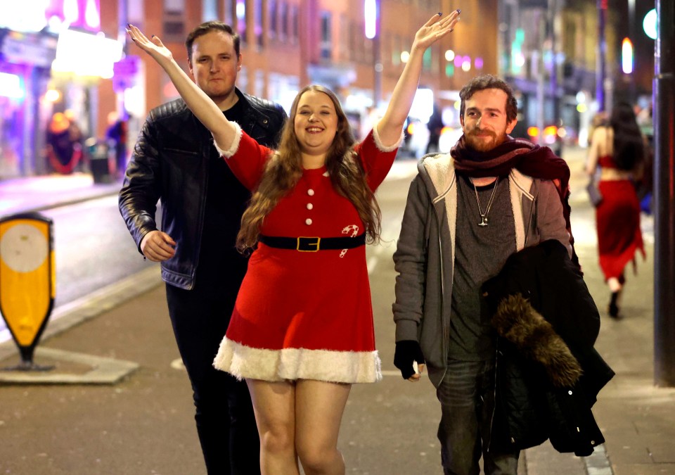 Three people celebrating Christmas Eve in Leeds.