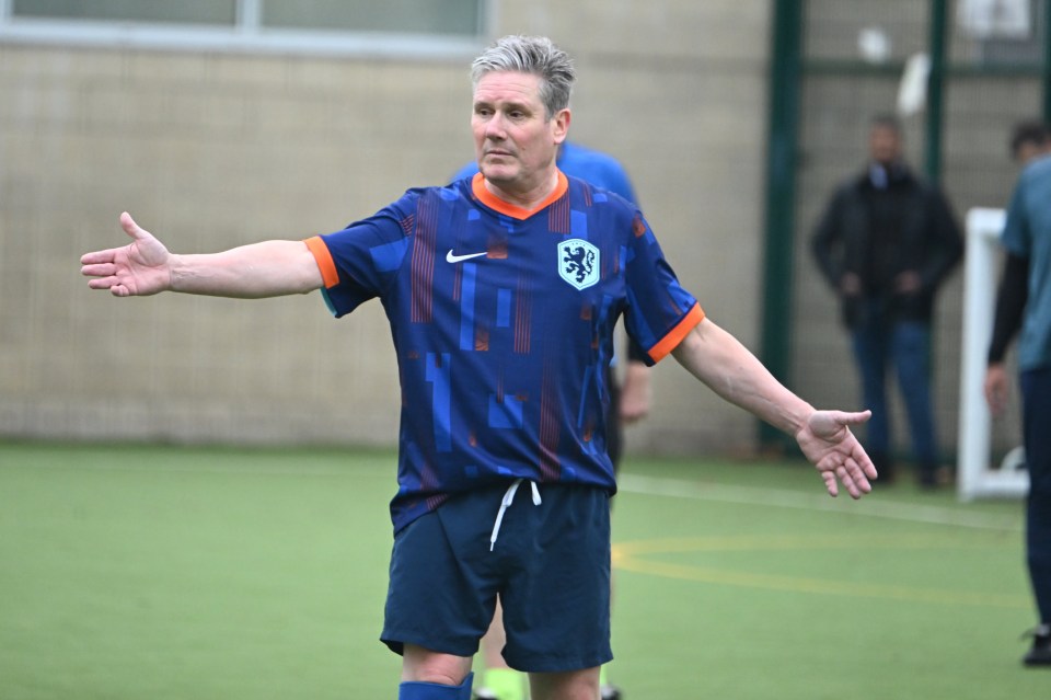 Keir Starmer playing football in a Dutch national team shirt.