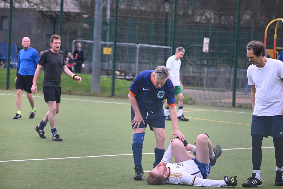 Keir Starmer playing football.