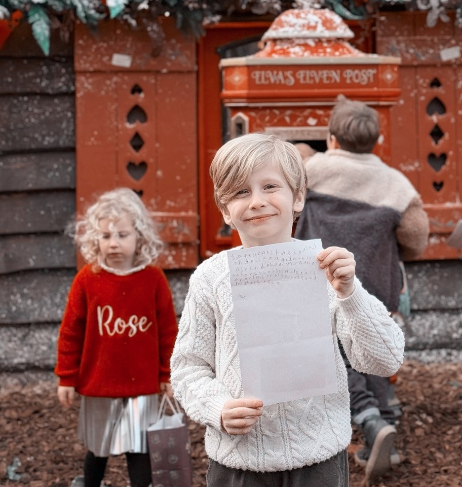 Boy holding letter at Lapland UK.