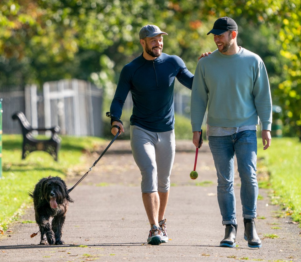 John goes for a walk with husband Paul Atkins