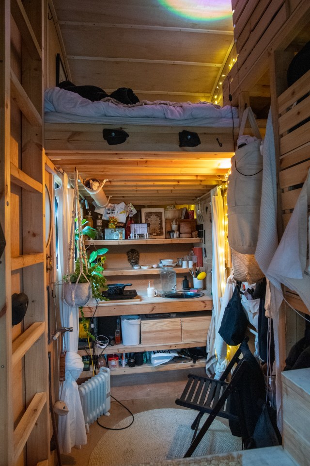 Interior of a tiny home built inside a converted shipping container.