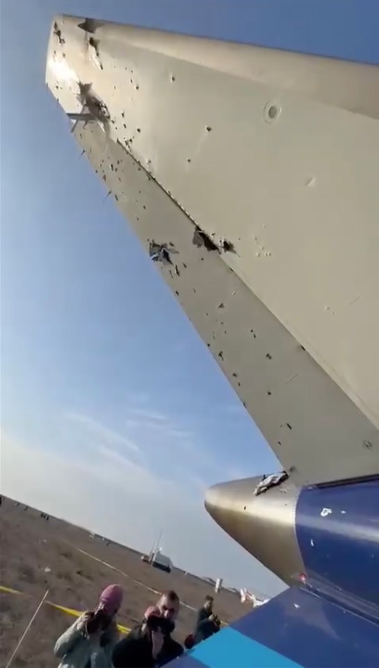 Suspected bullet holes in a plane's tail section.