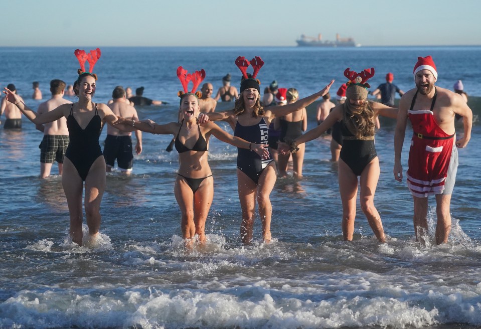 Other brave beachgoers opted for festive reindeer antlers