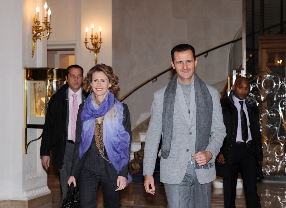 Bashar al-Assad and his wife Asma leaving a hotel.