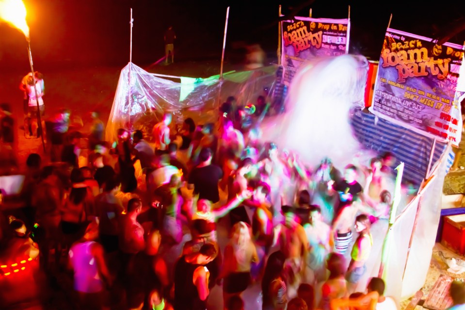 Revellers party until sunrise on the beach