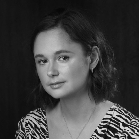 Black and white headshot of Phoebe Campbell-Harris.