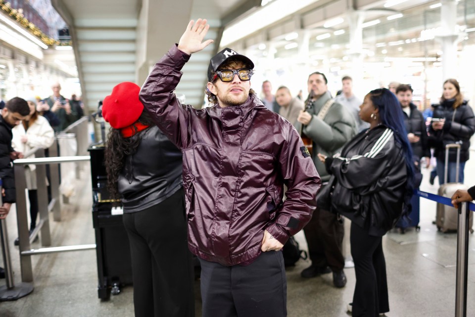 Tom Grennan performing at St. Pancras International Station.