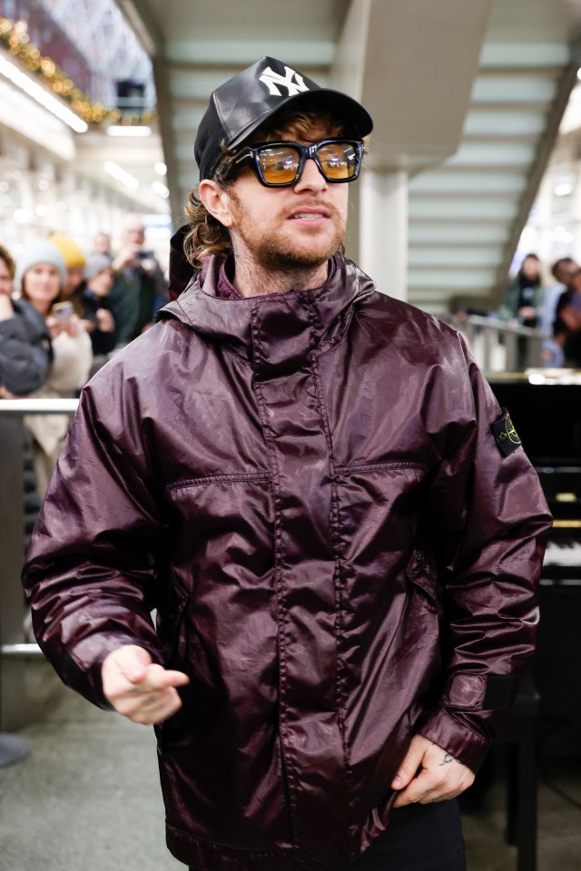 Tom Grennan performing at St. Pancras International Station.