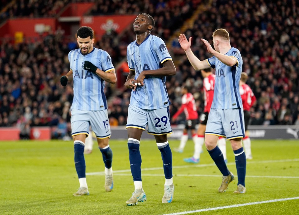 Pape Matar Sarr and Tottenham Hotspur teammates celebrating a goal.