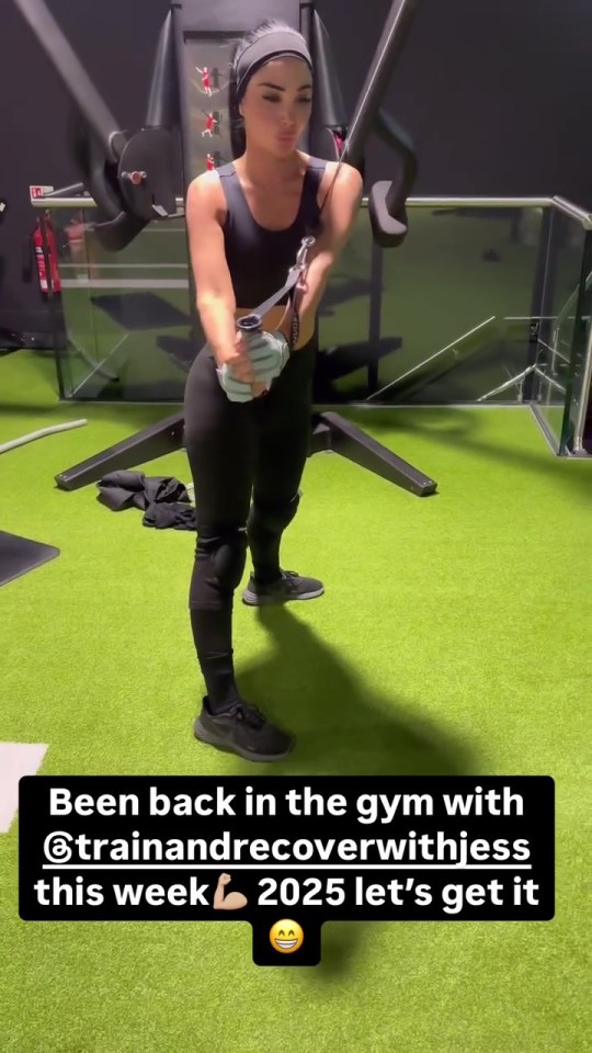 Woman working out on a cable machine at the gym.