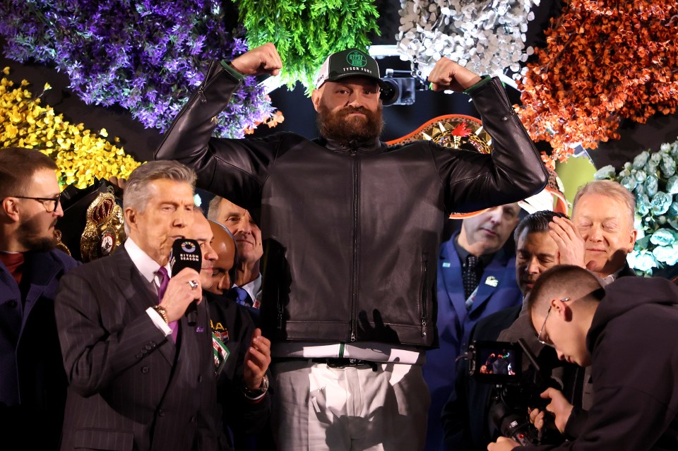 Tyson Fury and Oleksandr Usyk face off at a weigh-in.