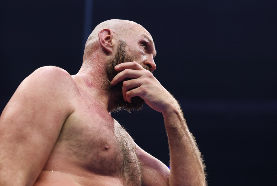 Tyson Fury reacts after losing a boxing match.