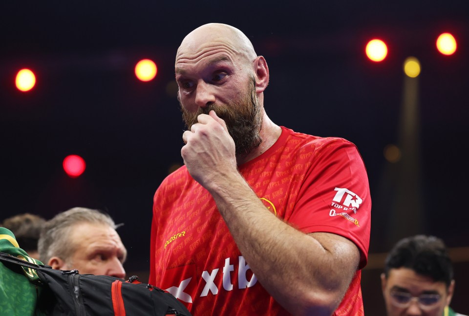 Tyson Fury reacts after losing a boxing match.