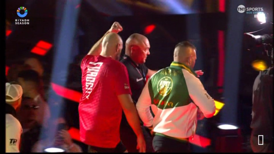 Tyson Fury being interviewed in the ring after a boxing match.