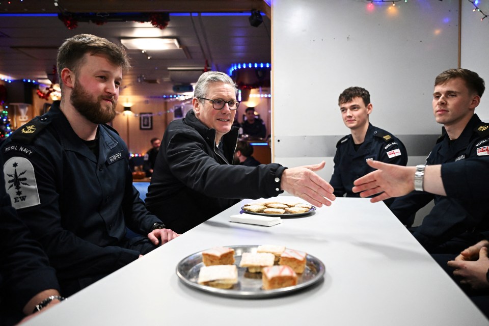 Starmer speaks with the crew as he tours HMS Iron Duke