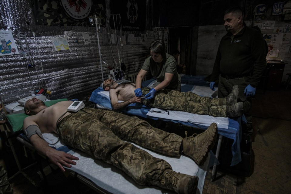 Medical personnel attend to wounded soldiers near Bakhmut, Ukraine, on 4 December 2024