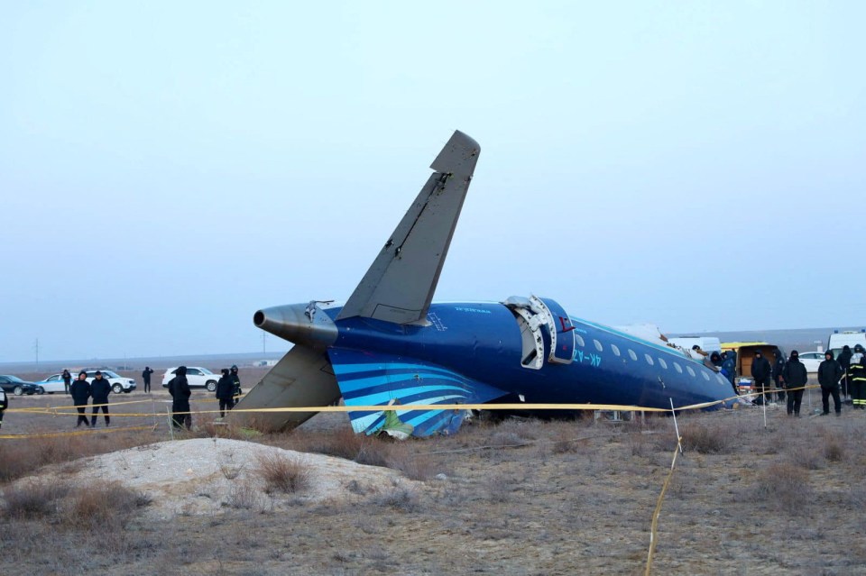 A view shows the wreckage of an Azerbaijan Airlines passenger plane at the crash site