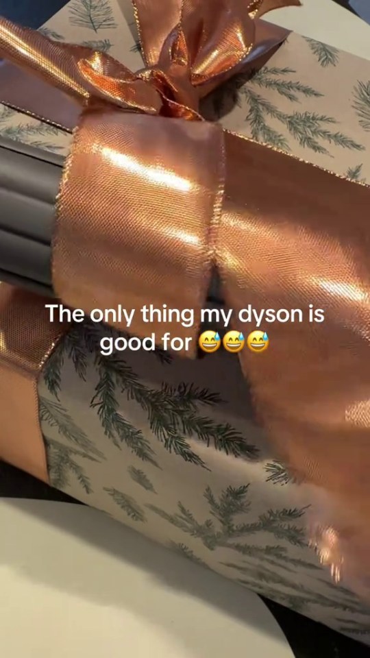 A Dyson used to curl ribbon on a Christmas present.