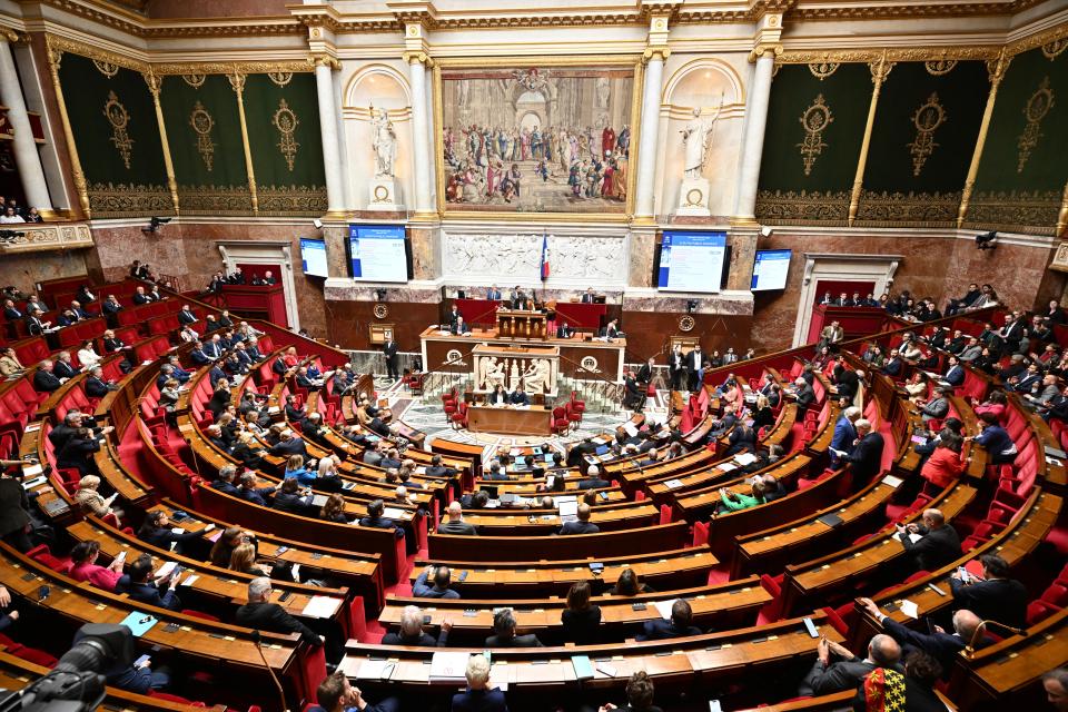 Lawmakers convene at the National Assembly during a debate and before the no-confidence vote