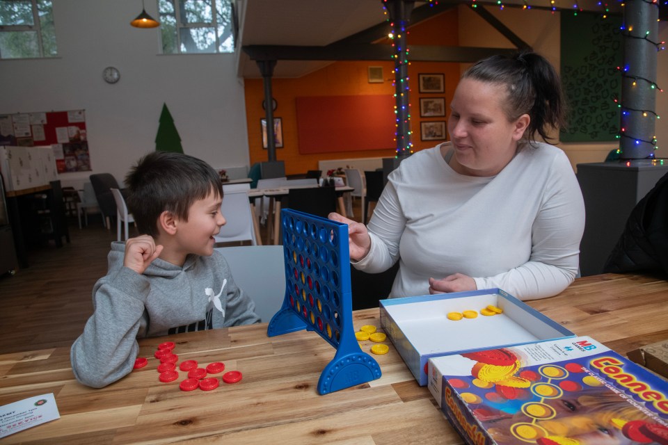 Amy Crutcher playing Connect Four with Gino, 7