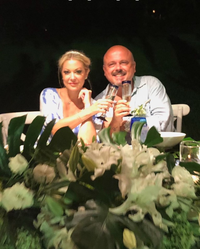 Walter Afanasieff and his wife Katie Cazorla toasting.