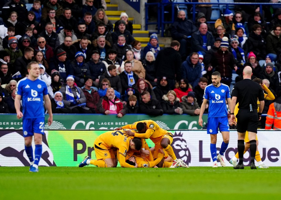 Wolverhampton Wanderers players celebrating a goal.