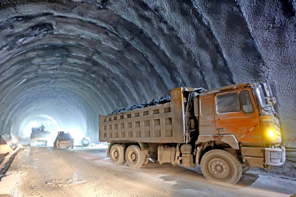 Workers at the construction site of a tunnel in the east Tianshan mountain