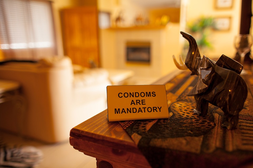 Condoms are mandatory sign.