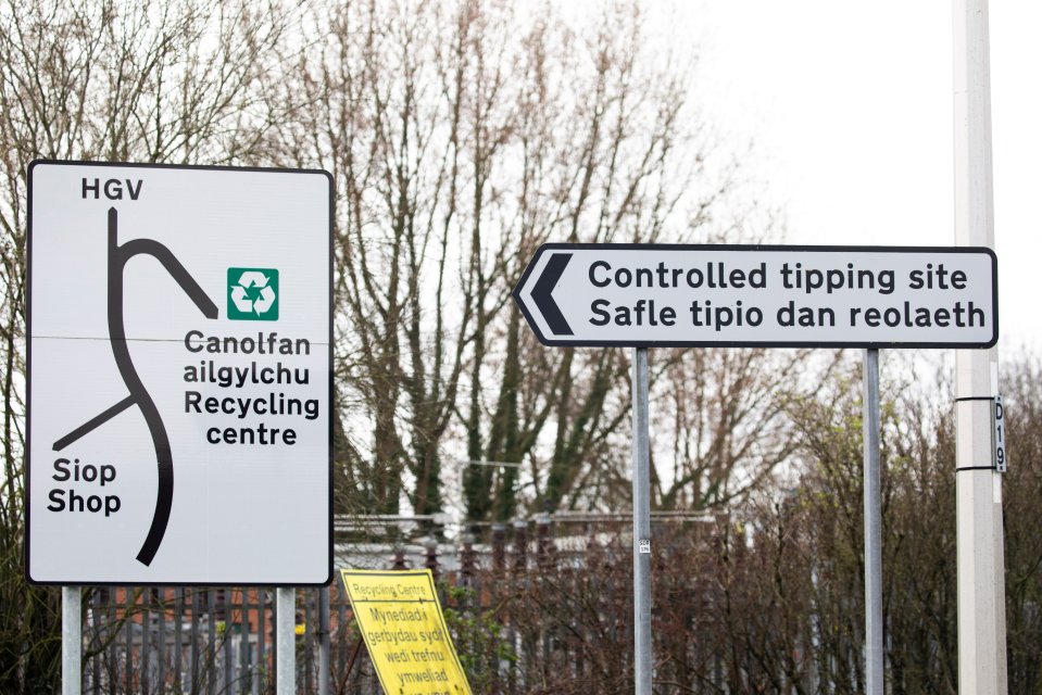 Signs for a recycling center and controlled tipping site.