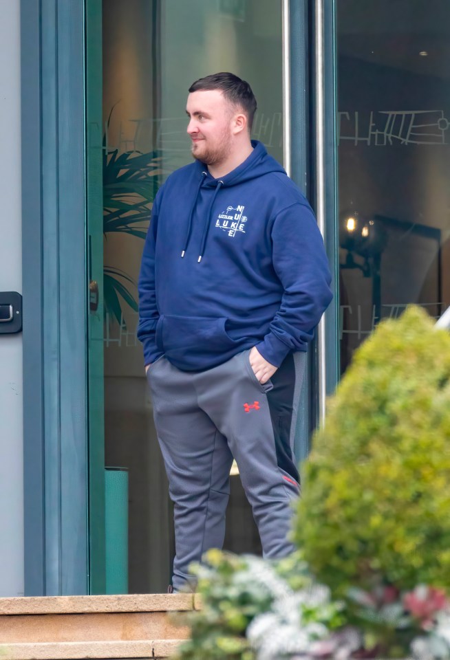 The new world champion looked relaxed in jogging trousers and personalised hoodie